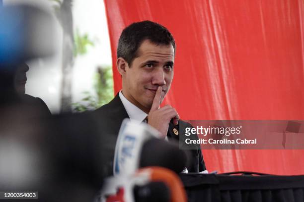 Opposition leader and reelected president of the National Assembly by anti-Maduro lawmakers majority Juan Guaido gestures during a National Assembly...