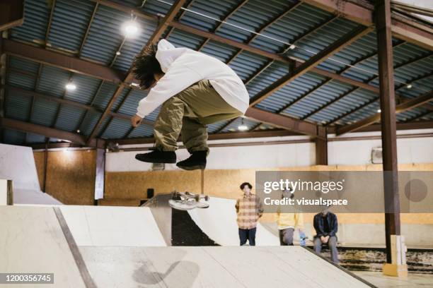 skateboarder making stunts on a ramp - skateboard park stock pictures, royalty-free photos & images