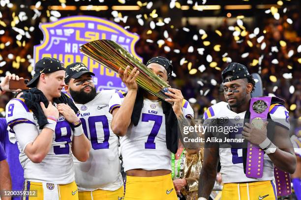 Grant Delpit of the LSU Tigers kisses the National Championship Trophy after the College Football Playoff National Championship game at the Mercedes...