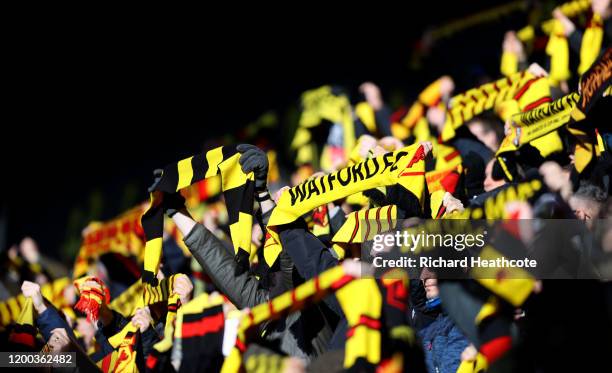 Watford supporters hold up their scarfs before kick off during the Premier League match between Watford FC and Tottenham Hotspur at Vicarage Road on...