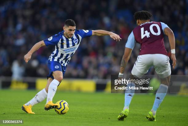 Neal Maupay of Brighton & Hove Albion runs at Tyrone Mings of Aston Villa during the Premier League match between Brighton & Hove Albion and Aston...