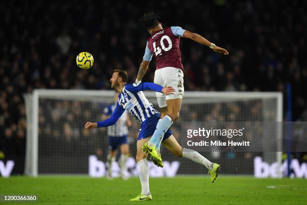 Glenn Murray of Brighton & Hove Albion challenges Tyrone Mings of Aston Villa during the Premier League match between Brighton & Hove Albion and...