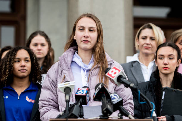 Canton High School senior Chelsea Mitchel speaks during a press conference with Alanna Smith, Danbury High School sophomore, to her left and Selina...
