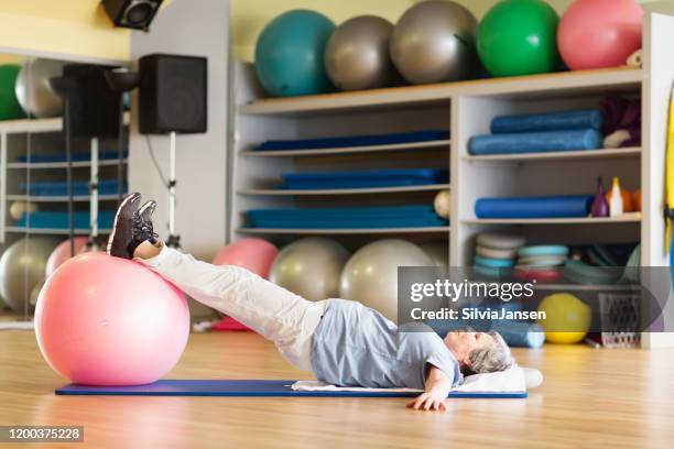 overweight senior womanexercising in gym - pelvic floor stock pictures, royalty-free photos & images