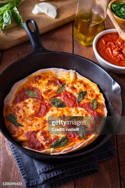 skillet pizza - skillet stock pictures, royalty-free photos & images