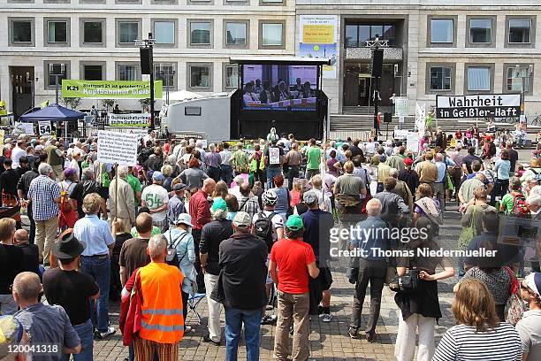 Protestors attend the public viewing during the conferece between the conflicting parties in the Stuttgart 21 railway station project on July 29,...