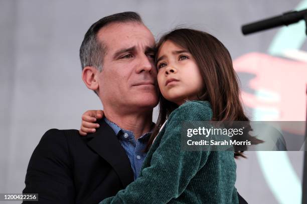 Los Angeles Mayor Eric Garcetti and his daughter participate in the 4th Annual Women's March LA: Women Rising at Pershing Square on January 18, 2020...