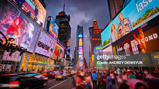 creative times square. advertising. billboard. crowd. tourist attraction - times square manhattan stockfoto's en -beelden