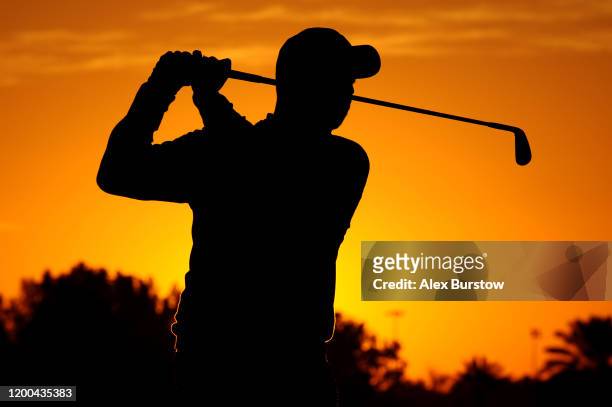 Silhouette of David Howell of England as he warms up on the range ahead of Day Four of the Abu Dhabi HSBC Championship at Abu Dhabi Golf Club on...