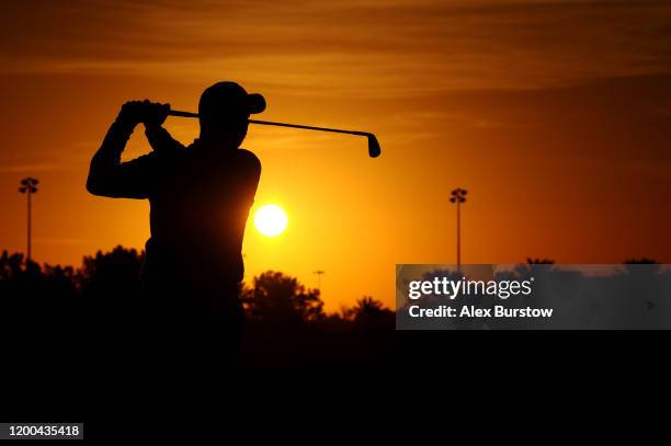 Silhouette of David Howell of England as he warms up on the range ahead of Day Four of the Abu Dhabi HSBC Championship at Abu Dhabi Golf Club on...