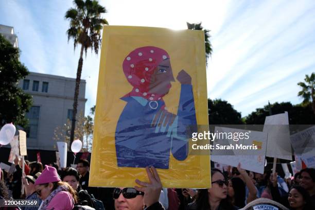 Signs are seen at the 4th Annual Women's March LA: Women Rising at Pershing Square on January 18, 2020 in Los Angeles, California.