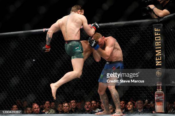 Conor McGregor lands a knee to the face of Donald Cerrone in the first round in a welterweight bout during UFC246 at T-Mobile Arena on January 18,...