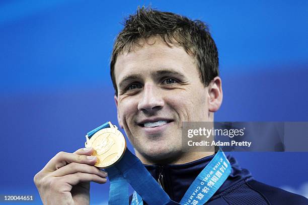 Ryan Lochte of the United States poses with his gold medal in the Men's 200m Backstroke Final during Day Fourteen of the 14th FINA World...