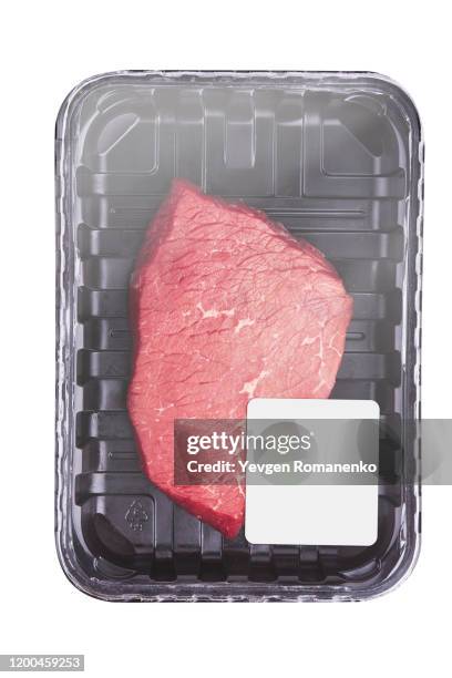 raw meat in plastic package with price tag, isolated on white background - meat packaging stockfoto's en -beelden