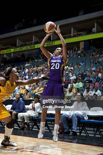 Kristi Toliver of the Los Angeles Sparks shoots the ball against Amber Holt of the Tulsa Shock during the WNBA game on July 15, 2011 at the BOK...