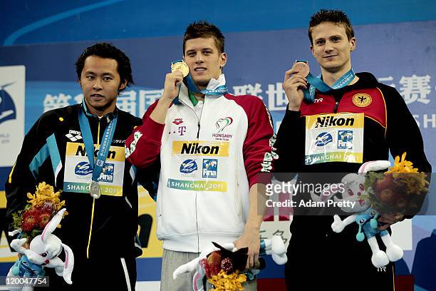 Gold medalist Daniel Gyurta of Hungary poses with silver medalist Kosuke Kitajima of Japan and bronze medalist Christian Vom Lehn of Germany after...