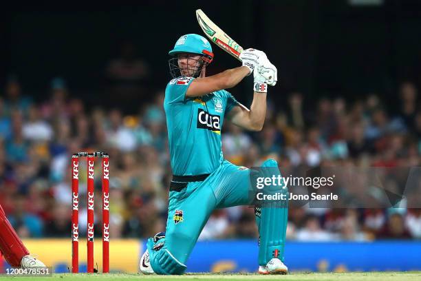 Chris Lynn of the Heat hits a six during the Big Bash League match between the Brisbane Heat and Melbourne Renegades at The Gabba on January 19, 2020...