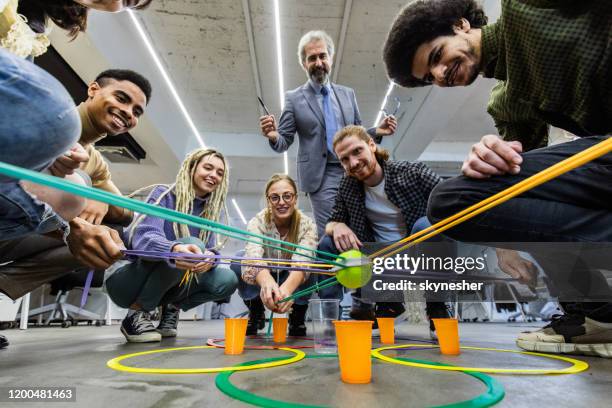 team building game at casual office! - team building stock pictures, royalty-free photos & images