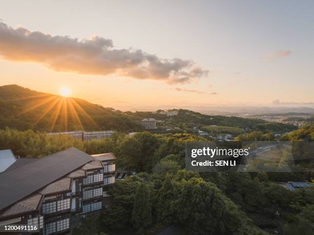 sunset view over the arima onsen city with mountains and traditional japanese buildings - kobe japan stock pictures, royalty-free photos & images