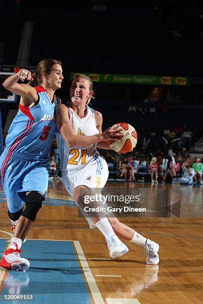 Courtney Vandersloot of the Chicago Sky drives the ball against Shalee Lehning of the Atlanta Dream on July 9, 2011 at the All-State Arena in...