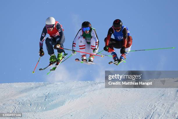 Scott Johns of Great Britain, Marcus Plank of Austria and Robin Tissieres of Switzerland compete in Men's ski cross in freestyle skiing during day 10...