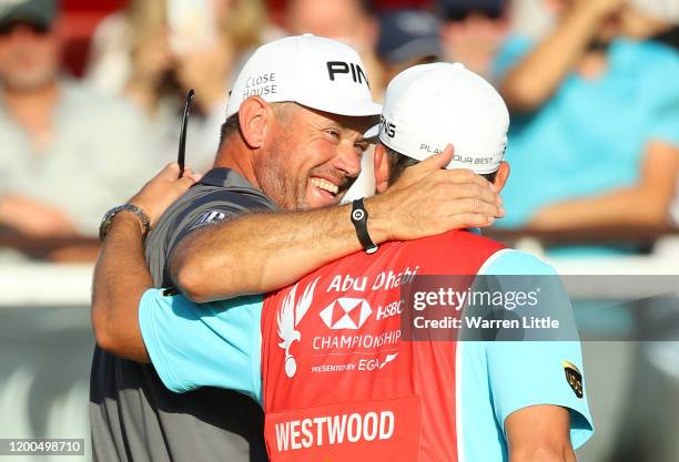 Lee Westwood of England celebrates with caddie following victory during Day 4 of the Abu Dhabi HSBC Championship at Abu Dhabi Golf Club on January...