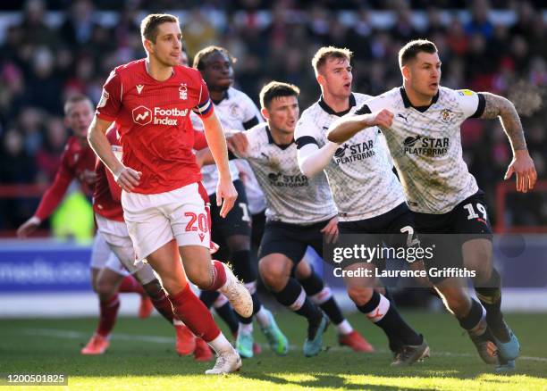 Michael Dawson of Nottingham Forest and James Collins of Luton Town prepare for a free kick during the Sky Bet Championship match between Nottingham...