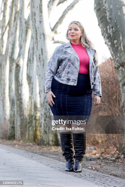 German presenter, curvy model and plus size influencer wearing a pink Top by C&A, a dark blue skirt and a Jeans Look Jacket by Marina Rinaldi and...