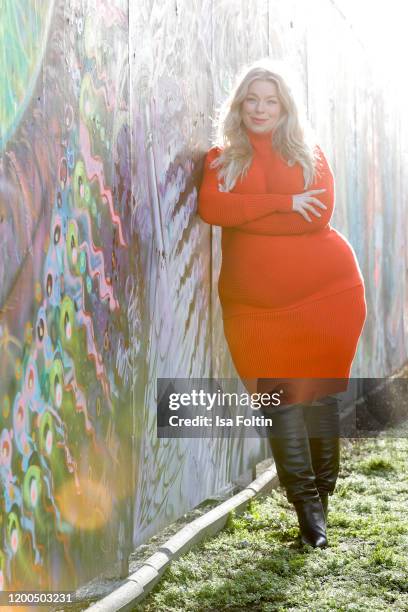 German presenter, curvy model and plus size influencer wearing a red Pullover, a red skirt and black boots by Riani during a street style shooting at...