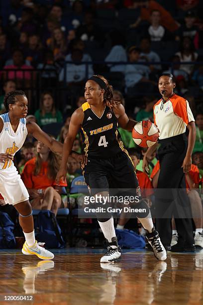 Amber Holt of the Tulsa Shock drives the ball against Epiphanny Prince of the Chicago Sky on July 13, 2011 at the All-State Arena in Rosemont,...