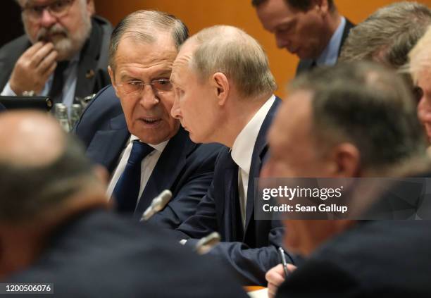 Russian President Vladimir Putin , Russian Foreign Minister Sergey Lavrov and U.S. Secretary of State Mike Pompeo attend the main session at an...