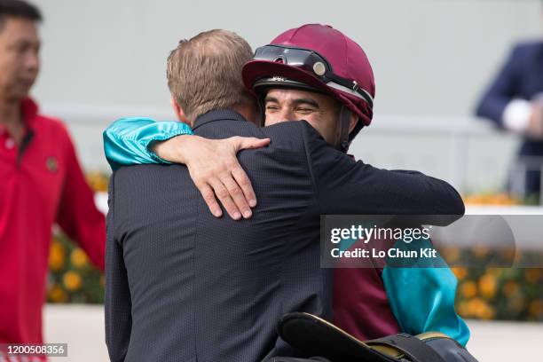 January 19 : Jockey Joao Moreira and trainer John Size celebrate after Beat The Clock winning Race 7 Centenary Sprint Cup at Sha Tin Racecourse on...