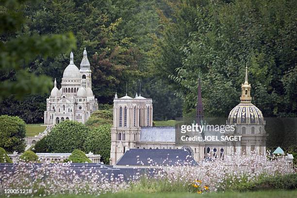 Miniature replicas of Paris Sacre-Coeur Basilic , Notre-Dame Cathedral and the Invalides at the 'France Miniature' leisure Park on July 29, 2011 in...
