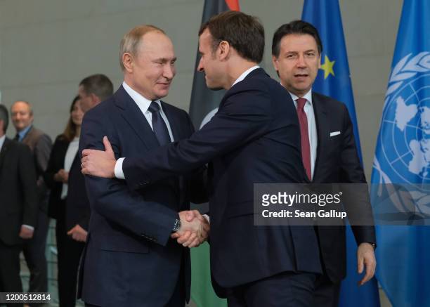 Russian President Vladimir Putin , French President Emmanuel Macron and Italian Prime Minister Giuseppe Conte attend an international summit on...
