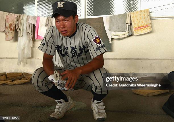 Baseball player weeps after their team didn't qualify in the national tournament during the High School Baseball Tournament Fukui Prefecture semi...