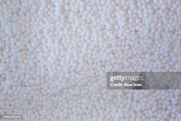 large group of polystyrene balls - perlenschmuck stock-fotos und bilder