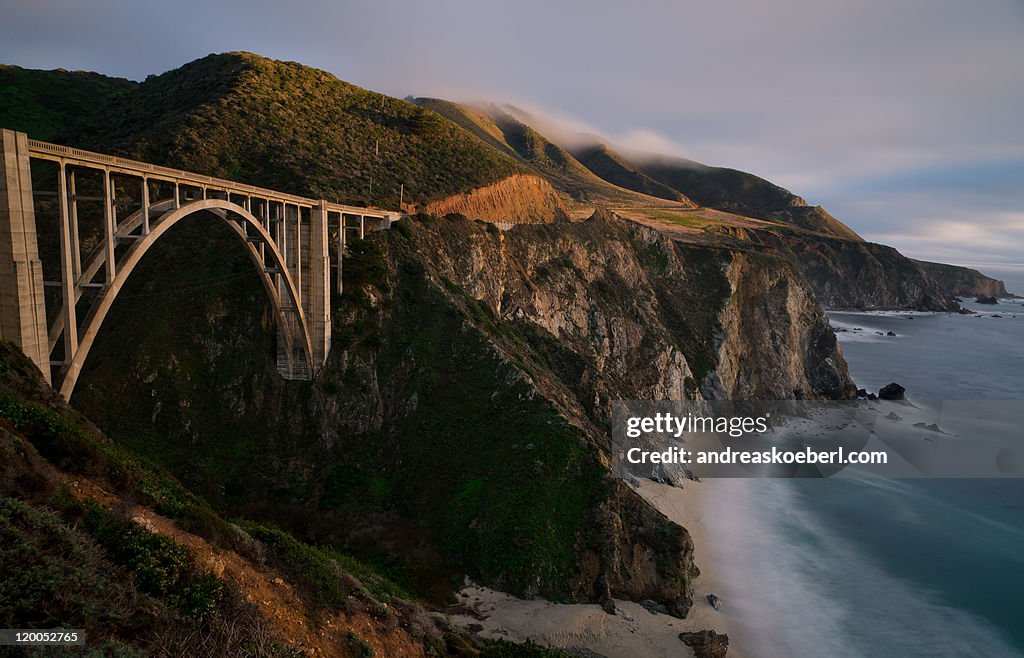 Bixby creek bridge at dusk lit by last light