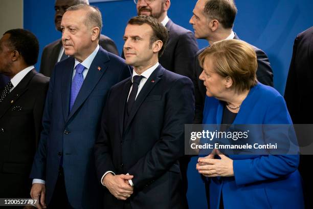 German Chancellor Angela Merkel , French President Emmanuel Macron and Turkish President Recep Tayyip Erdogan and other leaders pose for a family...