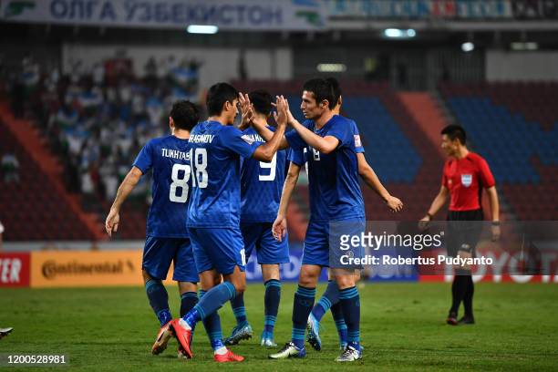 Uzbekistan players celebrate victory after beating UAE 5-1 during the AFC U-23 Championship quarter final match between UAE and Uzbekistan at...