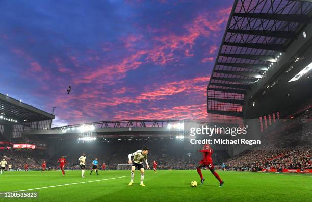 Sadio Mane of Liverpool takes on Victor Lindelof of Manchester United during the Premier League match between Liverpool FC and Manchester United at...