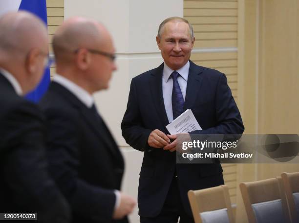 Russian President Vladimir Putin enters the hall during his meeting with a group on the Constitution's changes at Novo-Ogaryovo State residence...