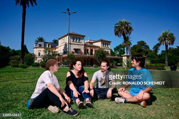 Argentinian Deb Barrerio , May Ferreira , Federico Franco and Gabriel Lopez pose for a picture at Avellaneda Park, in Buenos Aires, on February 4,...