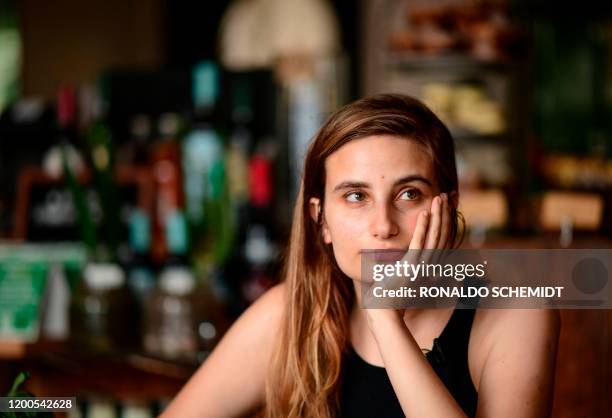 Argentine writer Tamara Tenenbaum poses during an interview with AFP, in Buenos Aires, on February 7, 2020. - "Polyamory" and other ways to conceive...