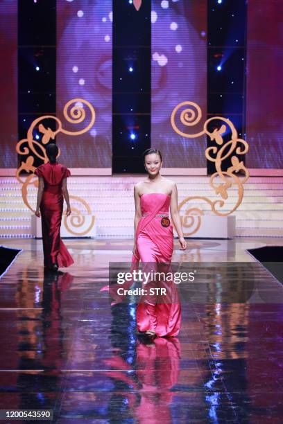 Chinese model parades during the 6th China Super Model contest final at the close of the China Fashion Week in Beijing on March 31, 2011. The...