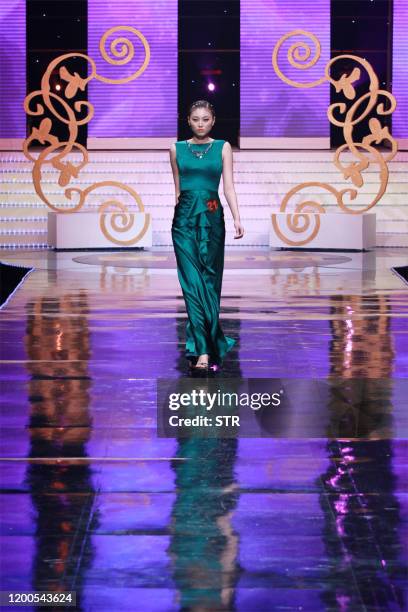 Chinese model parades during the 6th China Super Model contest final at the close of the China Fashion Week in Beijing on March 31, 2011. The...