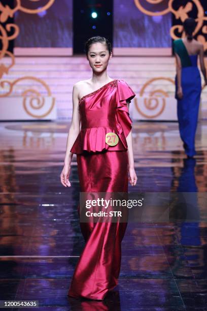 Chinese model parades during the 6th China Super Model contest final at the close of the China Fashion Week in Beijing on March 31, 2011. The...