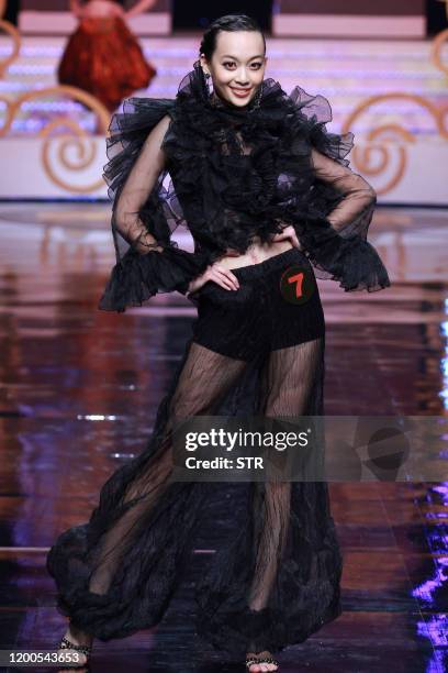 Chinese model parades during the 6th China Super Model contest final at the close of the China Fashion Week in Beijing on March 31, 2011. The...