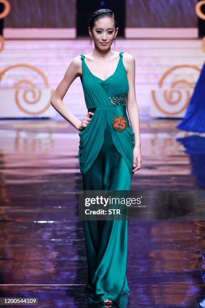 Chinese model parades during the 6th China Super Model contest final at the close of the China Fashion Week in Beijing on March 31, 2011. The...