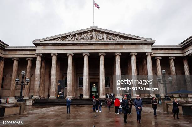 People walk past the British Museum in London. The museum, one of London's top tourist attractions, is rarely far from controversy, from its...