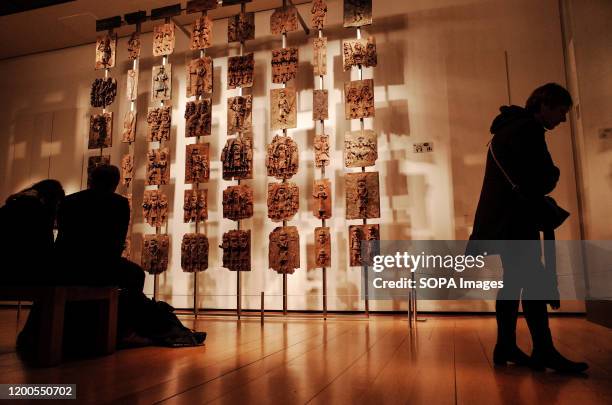 Visitors view the contentious Benin plaques exhibit at the British Museum in London. The museum, one of London's top tourist attractions, is rarely...